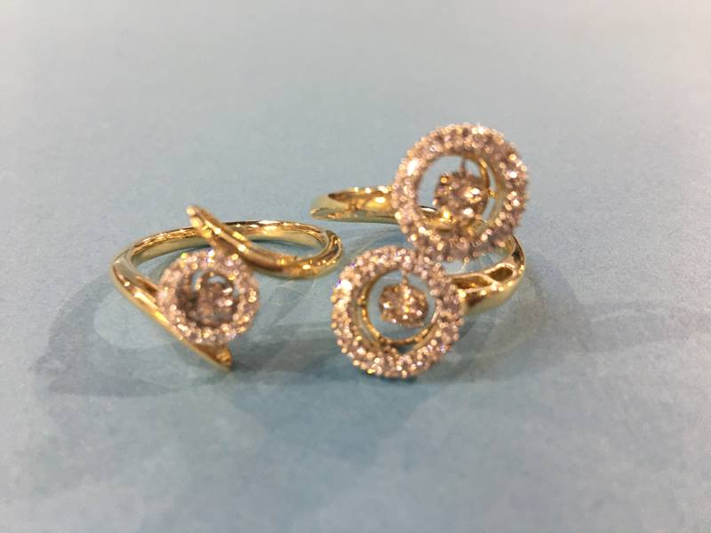 Two 14kt gold diamond set rings, both size 'Q' (cost £1922)