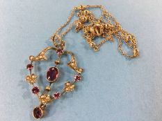 An Edwardian 9ct gold amethyst and seed pearl pendant and 9ct gold chain, total weight 4.4g