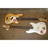 Two autographed Bass guitars