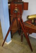 An Edwardian mahogany plate camera and stand