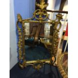 Ornate gilt mirror, 129cm x 72cm