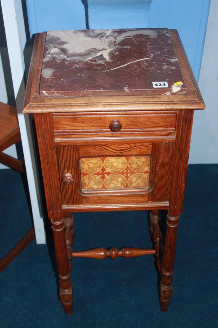 A Continental pine marble top bedside cabinet