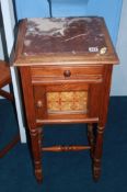 A Continental pine marble top bedside cabinet