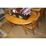 Teak oval dining table with four chairs