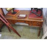 A Victorian mahogany side table with five drawers, supported on turned tapering legs, 121cm wide