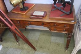 A Victorian mahogany side table with five drawers, supported on turned tapering legs, 121cm wide