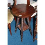 A mahogany circular two tier occasional table
