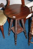 A mahogany circular two tier occasional table