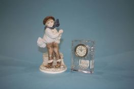 A large Waterford crystal clock (boxed), a small Waterford clock and a Coalport figure
