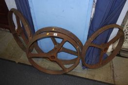 Four cast iron wagon wheels, 60cm diameter