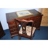 A reproduction mahogany pedestal desk and chair