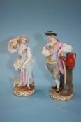 A pair of 19th century Meissen porcelain figures of a gallant and lady supported on a circular base,