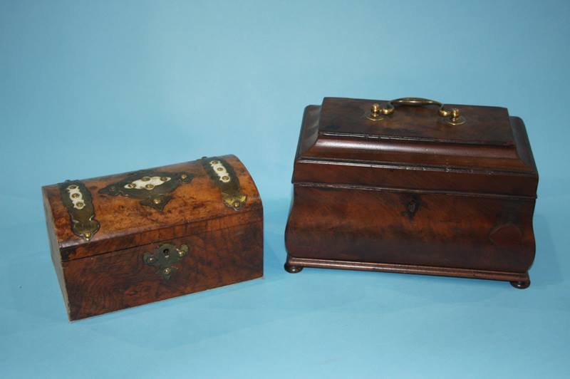 A 19th century mahogany tea caddy and a walnut domed casket