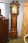 An oak cased long case clock, with painted dial, eight day movement, two subsidiary dials