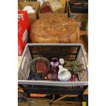 A box of miscellaneous decorative items and a footstool