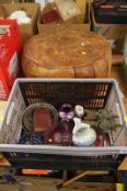 A box of miscellaneous decorative items and a footstool