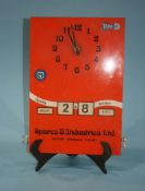 A Target 'Spares and Industries Ltd' clock and calendar