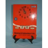 A Target 'Spares and Industries Ltd' clock and calendar