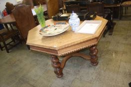 A large Continental oak octagonal dining table, with barley twist legs, 127cm wide