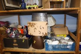 Shelf of table lamps, glassware and a tea set