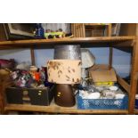 Shelf of table lamps, glassware and a tea set