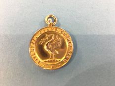 A 9ct gold medal, decorated with a liver bird and 'Liverpool Championship Club', engraved 'Won' by