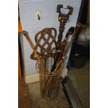 A brolley reciever and various walking canes etc.
