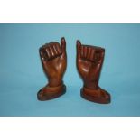 A pair of carved teak hands