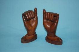 A pair of carved teak hands