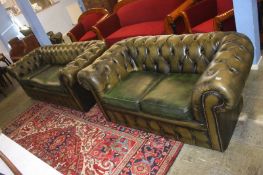 Two green leather button back Chesterfield settees