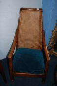 Two oak framed bergere armchairs