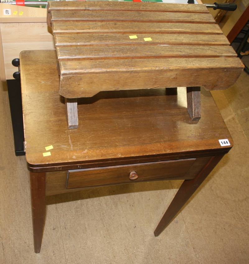 A sewing machine table and wooden footstool
