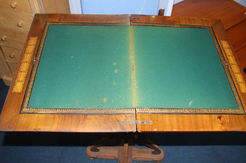 A Victorian walnut games/work table with chess board top, the top opening to reveal a green baize - Image 2 of 3