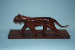 A carved coromandel model of a Puma, 55cm length