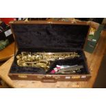 A cased 'The Horn' saxophone