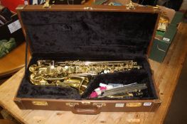 A cased 'The Horn' saxophone