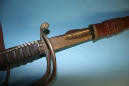 A Cavalry Officers sword, stamped Henry Wilkinson Pall Mall, with service scabbard