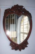 A mahogany heart shaped mirror, 88cm x 57cm