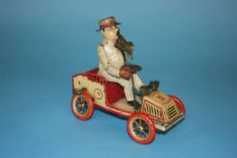 A 1920s Lehmann tinplate clockwork tin plate 490 'Tut Tut' automobile, the cream car with red