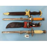 Three replica German daggers and one other