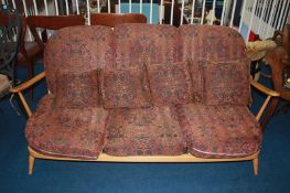 An Ercol Golden Dawn, three seater 'Windsor' spindle back settee
