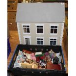 A dolls house, to include dolls and miniature furniture and fixtures