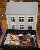 A dolls house, to include dolls and miniature furniture and fixtures