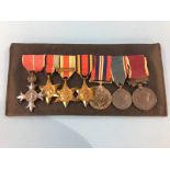 A group of medals to SJT R.W. White IACC, including Long and Gold service medal, OBE Africa Star,