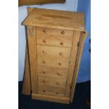 An oak Wellington chest having seven drawers, 48cm wide