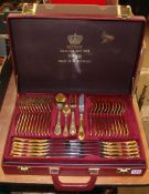 A 23-24ct gold plated set of cutlery, in case