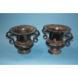 A pair of silver plated two handled cups, 25cm height