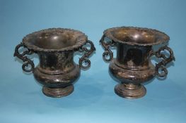 A pair of silver plated two handled cups, 25cm height