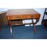 A reproduction mahogany sofa table, with leather inset top