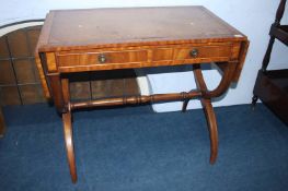 A reproduction mahogany sofa table, with leather inset top